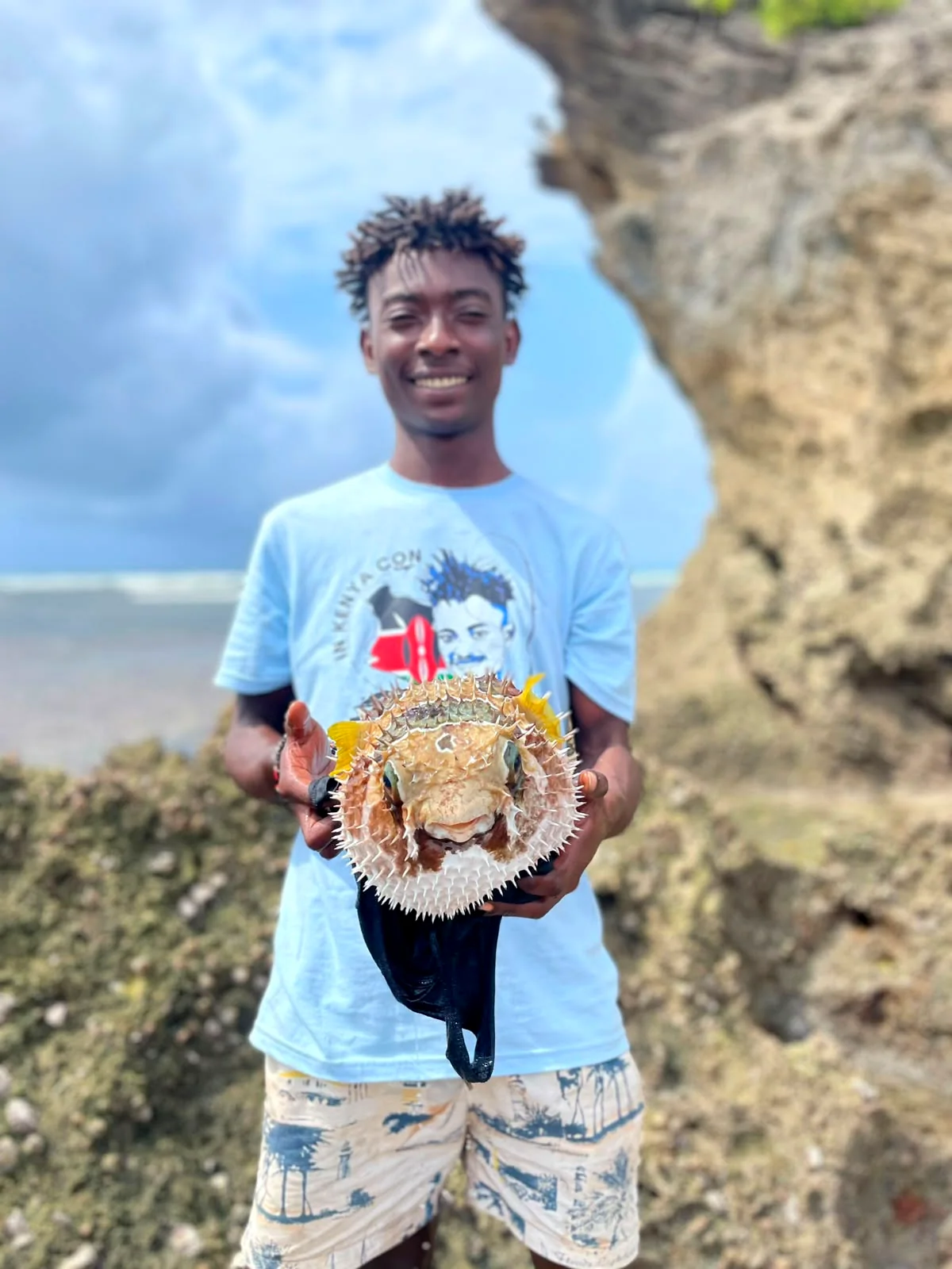 Sameer on the Kenyan coast with marine life
